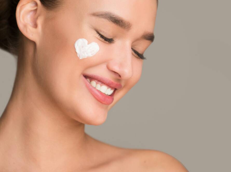 Anti wrinkle cream. Woman with cream in heart shape