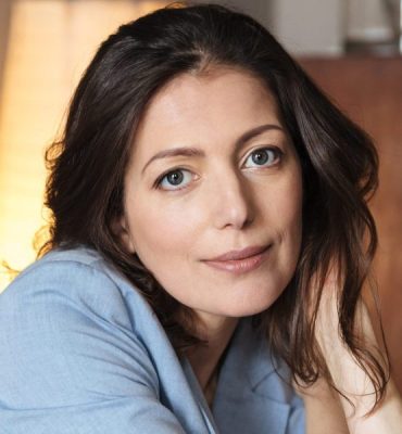 amazing woman sitting indoors table 1 scaled e1767716259176 aesthetic medical spa treatment McLean VA En Santé Med