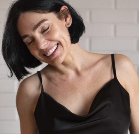 medium shot smiley woman posing home scaled e1767554597824 aesthetic medical spa treatment McLean VA En Santé Med