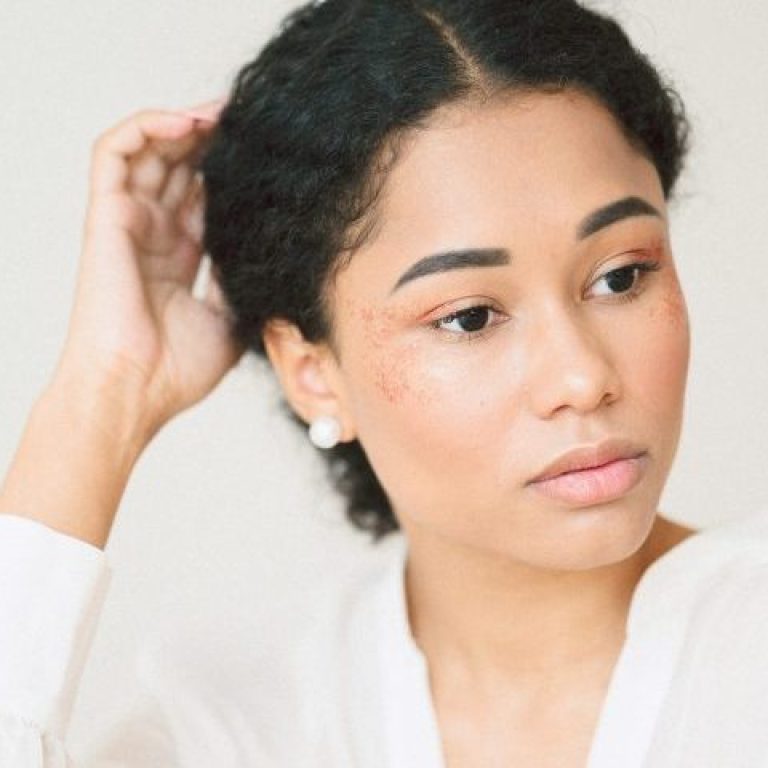 portrait beautiful lady room sitting thinking long white dress scaled e1771201037944 aesthetic medical spa treatment McLean VA En Santé Med