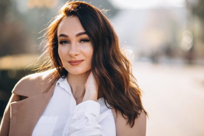 portrait woman white shirt coat 1 scaled e1767676102790 aesthetic medical spa treatment McLean VA En Santé Med