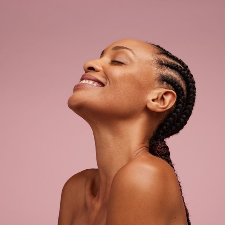 Close-up,Of,A,Natural,Beauty,Smiling,On,Pink,Background.,Woman