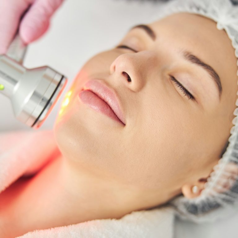 young woman at a light therapy session aesthetic medical spa treatment McLean VA En Santé Med
